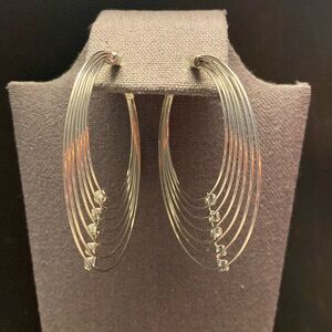 Silver tone hoops pierced earrings with 5 rhinestones each